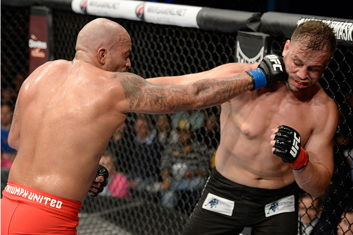 BARUERI, BRAZIL - OCTOBER 9: (L-R) Joey Beltran punches Fabio Maldonado in their light heavyweight bout during the UFC Fight Night event at the Ginasio Jose Correa on October 9, 2013 in Barueri, Sao Paulo, Brazil. (Photo by Jeff Bottari/Zuffa LLC/Zuffa L