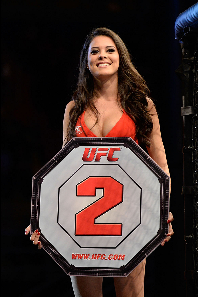 BARUERI, BRAZIL - OCTOBER 9: UFC Octagon Girl Camila Rodrigues de Oliveira walks the Octagon between rounds during the Iliarde Santos and Chris Cariaso (not pictured) fight in their flyweight bout during the UFC Fight Night event at the Ginasio Jose Corr