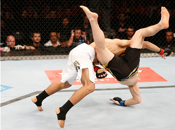 GOIANIA, BRAZIL - NOVEMBER 09: (L-R) Jose Maria takes down Dustin Ortiz in their flyweight bout during the UFC event at Arena Goiania on November 9, 2013 in Goiania, Brazil. (Photo by Josh Hedges/Zuffa LLC/Zuffa LLC via Getty Images)