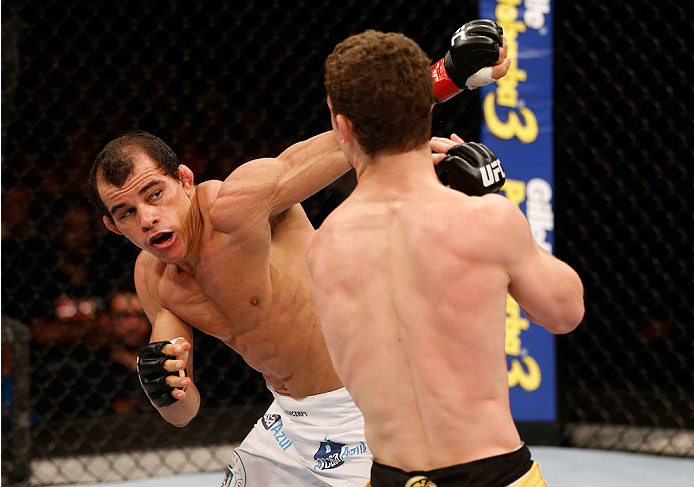 GOIANIA, BRAZIL - NOVEMBER 09: (L-R) Jose Maria punches Dustin Ortiz in their flyweight bout during the UFC event at Arena Goiania on November 9, 2013 in Goiania, Brazil. (Photo by Josh Hedges/Zuffa LLC/Zuffa LLC via Getty Images)