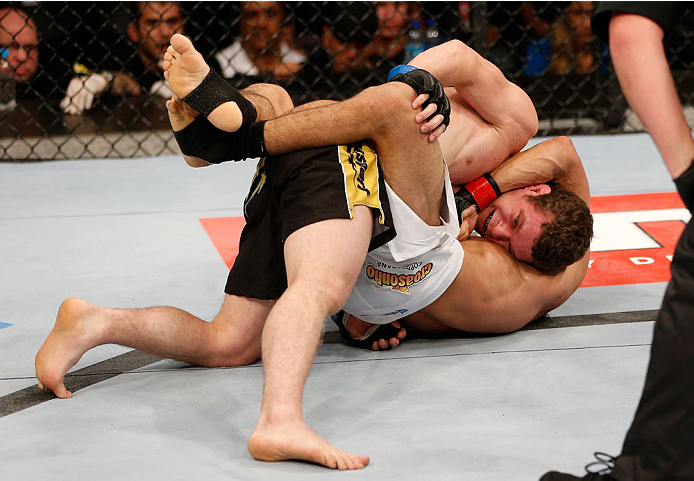 GOIANIA, BRAZIL - NOVEMBER 09: (R-L) Jose Maria attempts a guillotine choke submission against Dustin Ortiz in their flyweight bout during the UFC event at Arena Goiania on November 9, 2013 in Goiania, Brazil. (Photo by Josh Hedges/Zuffa LLC/Zuffa LLC via