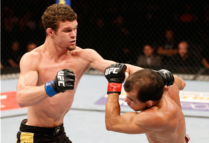GOIANIA, BRAZIL - NOVEMBER 09: (L-R) Dustin Ortiz punches Jose Maria in their flyweight bout during the UFC event at Arena Goiania on November 9, 2013 in Goiania, Brazil. (Photo by Josh Hedges/Zuffa LLC/Zuffa LLC via Getty Images)