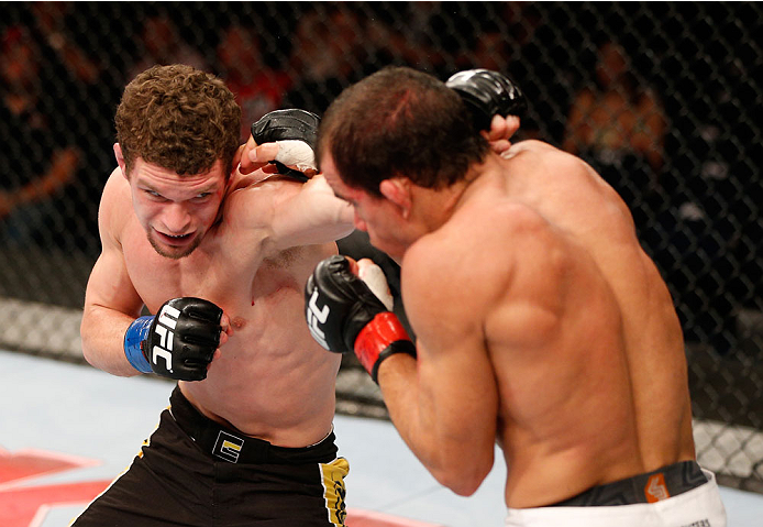 GOIANIA, BRAZIL - NOVEMBER 09: (L-R) Dustin Ortiz punches Jose Maria in their flyweight bout during the UFC event at Arena Goiania on November 9, 2013 in Goiania, Brazil. (Photo by Josh Hedges/Zuffa LLC/Zuffa LLC via Getty Images)