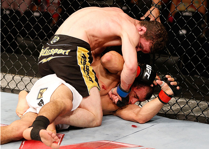 GOIANIA, BRAZIL - NOVEMBER 09: (L-R) Dustin Ortiz punches Jose Maria in their flyweight bout during the UFC event at Arena Goiania on November 9, 2013 in Goiania, Brazil. (Photo by Josh Hedges/Zuffa LLC/Zuffa LLC via Getty Images)