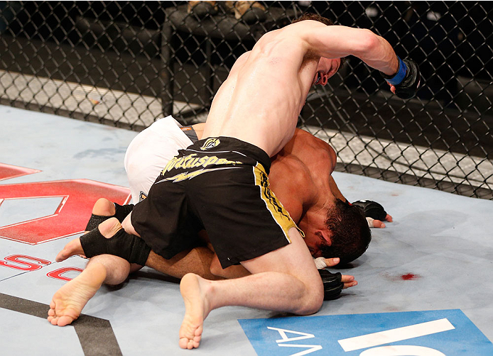 GOIANIA, BRAZIL - NOVEMBER 09: (L-R) Dustin Ortiz punches Jose Maria in their flyweight bout during the UFC event at Arena Goiania on November 9, 2013 in Goiania, Brazil. (Photo by Josh Hedges/Zuffa LLC/Zuffa LLC via Getty Images)