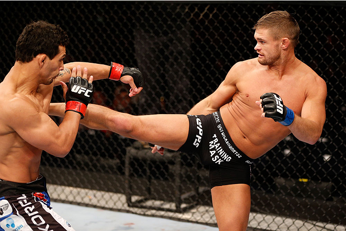 GOIANIA, BRAZIL - NOVEMBER 09: (R-L) Daron Cruickshank kicks Adriano Martins in their lightweight bout during the UFC event at Arena Goiania on November 9, 2013 in Goiania, Brazil. (Photo by Josh Hedges/Zuffa LLC/Zuffa LLC via Getty Images)