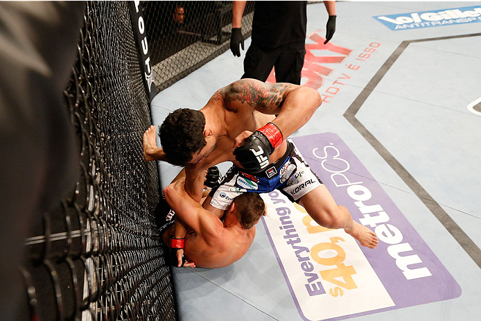 GOIANIA, BRAZIL - NOVEMBER 09: (R-L) Adriano Martins punches Daron Cruickshank in their lightweight bout during the UFC event at Arena Goiania on November 9, 2013 in Goiania, Brazil. (Photo by Josh Hedges/Zuffa LLC/Zuffa LLC via Getty Images)