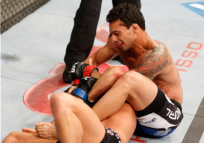 GOIANIA, BRAZIL - NOVEMBER 09: (R-L) Adriano Martins attempts an arm bar submission against Daron Cruickshank in their lightweight bout during the UFC event at Arena Goiania on November 9, 2013 in Goiania, Brazil. (Photo by Josh Hedges/Zuffa LLC/Zuffa LLC