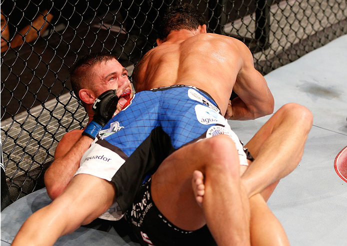 GOIANIA, BRAZIL - NOVEMBER 09: (R-L) Adriano Martins secures an Americana submission against Daron Cruickshank in their lightweight bout during the UFC event at Arena Goiania on November 9, 2013 in Goiania, Brazil. (Photo by Josh Hedges/Zuffa LLC/Zuffa LL