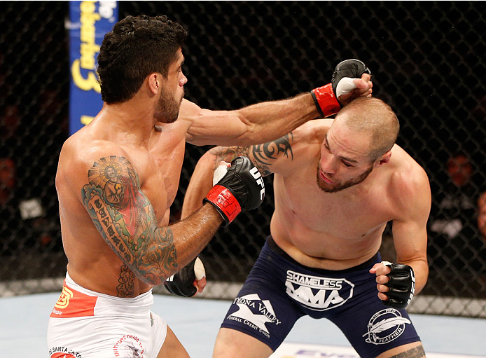 GOIANIA, BRAZIL - NOVEMBER 09: (L-R) Thiago Tavares punches Justin Salas in their lightweight bout during the UFC event at Arena Goiania on November 9, 2013 in Goiania, Brazil. (Photo by Josh Hedges/Zuffa LLC/Zuffa LLC via Getty Images)