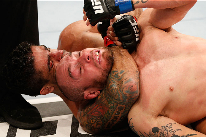 GOIANIA, BRAZIL - NOVEMBER 09: (L-R) Thiago Tavares secures a rear choke submission against Justin Salas in their lightweight bout during the UFC event at Arena Goiania on November 9, 2013 in Goiania, Brazil. (Photo by Josh Hedges/Zuffa LLC/Zuffa LLC via