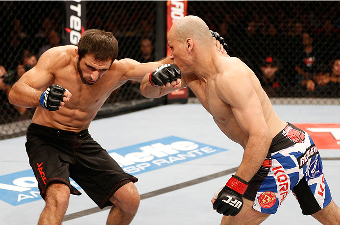 GOIANIA, BRAZIL - NOVEMBER 09: (R-L) Thiago Perpetuo punches Omari Akhmedov in their middleweight bout during the UFC event at Arena Goiania on November 9, 2013 in Goiania, Brazil. (Photo by Josh Hedges/Zuffa LLC/Zuffa LLC via Getty Images)