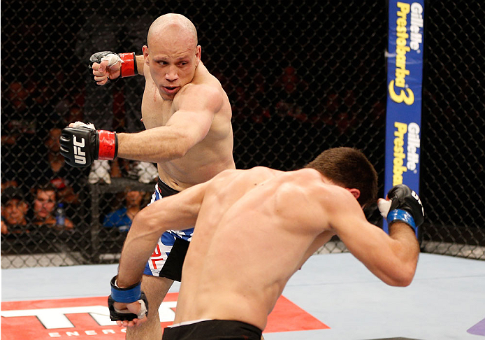 GOIANIA, BRAZIL - NOVEMBER 09: (L-R) Thiago Perpetuo punches Omari Akhmedov in their middleweight bout during the UFC event at Arena Goiania on November 9, 2013 in Goiania, Brazil. (Photo by Josh Hedges/Zuffa LLC/Zuffa LLC via Getty Images)