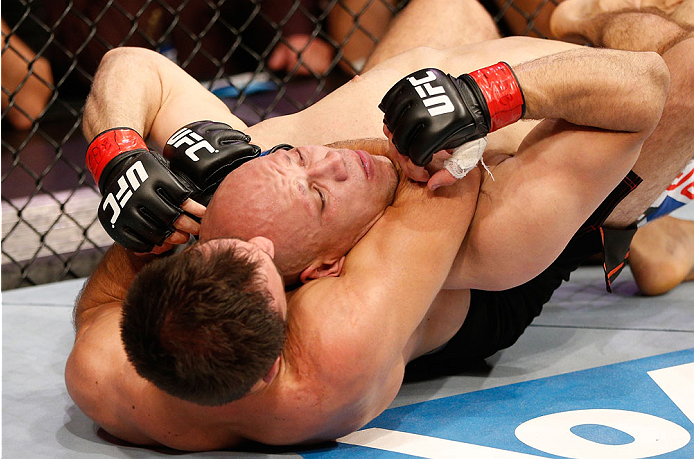 GOIANIA, BRAZIL - NOVEMBER 09: (L-R) Omari Akhmedov attempts a rear choke submission against Thiago Perpetuo in their middleweight bout during the UFC event at Arena Goiania on November 9, 2013 in Goiania, Brazil. (Photo by Josh Hedges/Zuffa LLC/Zuffa LLC