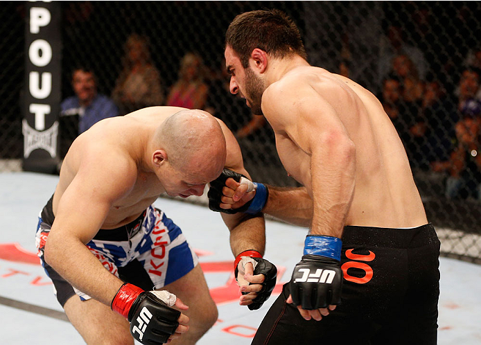 GOIANIA, BRAZIL - NOVEMBER 09: (R-L) Omari Akhmedov drops Thiago Perpetuo with a punch in their middleweight bout during the UFC event at Arena Goiania on November 9, 2013 in Goiania, Brazil. (Photo by Josh Hedges/Zuffa LLC/Zuffa LLC via Getty Images)