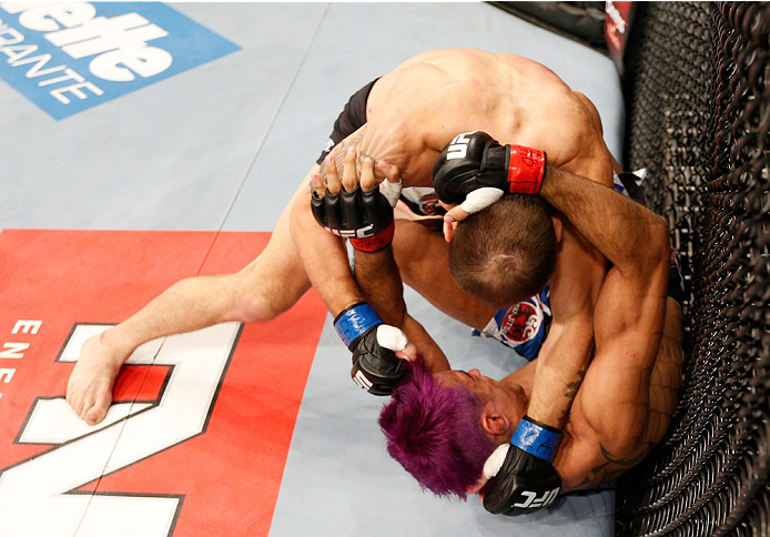 GOIANIA, BRAZIL - NOVEMBER 09: (L-R) Sam Sicilia punches Godofredo ''Pepey'' Castro in their featherweight bout during the UFC event at Arena Goiania on November 9, 2013 in Goiania, Brazil. (Photo by Josh Hedges/Zuffa LLC/Zuffa LLC via Getty Images)