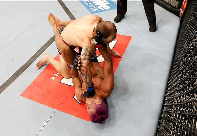 GOIANIA, BRAZIL - NOVEMBER 09: (L-R) Sam Sicilia punches Godofredo ''Pepey'' Castro in their featherweight bout during the UFC event at Arena Goiania on November 9, 2013 in Goiania, Brazil. (Photo by Josh Hedges/Zuffa LLC/Zuffa LLC via Getty Images)