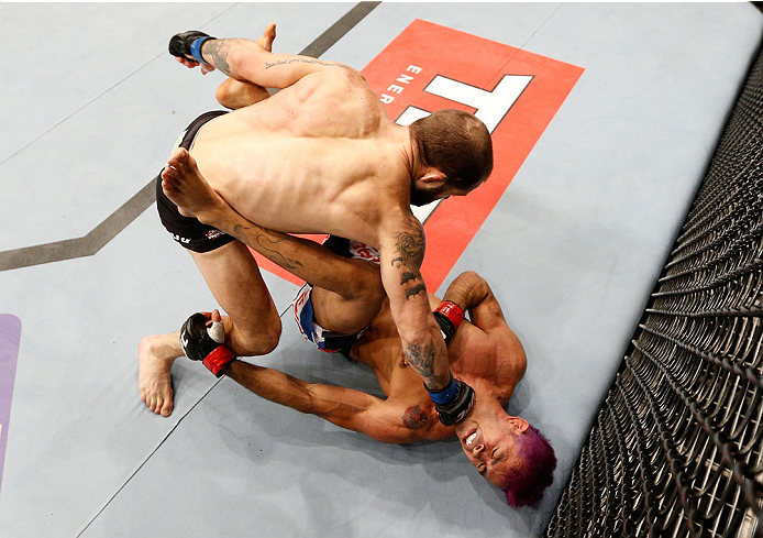 GOIANIA, BRAZIL - NOVEMBER 09: (L-R) Sam Sicilia punches Godofredo ''Pepey'' Castro in their featherweight bout during the UFC event at Arena Goiania on November 9, 2013 in Goiania, Brazil. (Photo by Josh Hedges/Zuffa LLC/Zuffa LLC via Getty Images)
