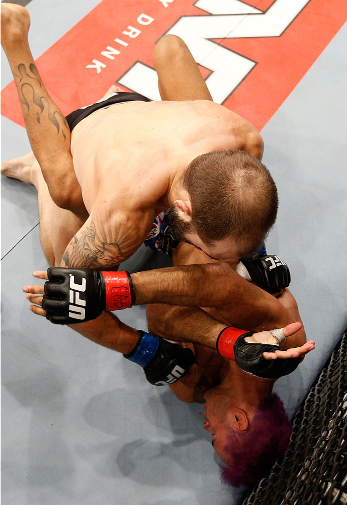 GOIANIA, BRAZIL - NOVEMBER 09: (L-R) Sam Sicilia punches Godofredo ''Pepey'' Castro in their featherweight bout during the UFC event at Arena Goiania on November 9, 2013 in Goiania, Brazil. (Photo by Josh Hedges/Zuffa LLC/Zuffa LLC via Getty Images)