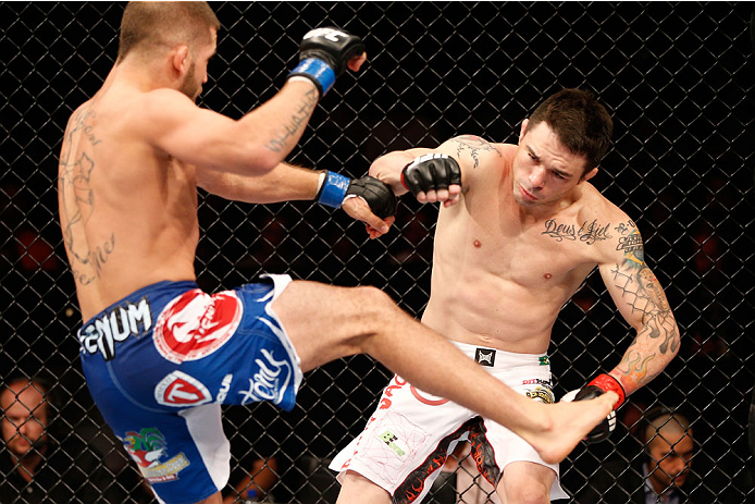 GOIANIA, BRAZIL - NOVEMBER 09: Rony ''Jason'' Mariano Bezerra (R) falls to the canvas after a kick from Jeremy Stephens (L) in their featherweight bout during the UFC event at Arena Goiania on November 9, 2013 in Goiania, Brazil. (Photo by Josh Hedges/Zuf