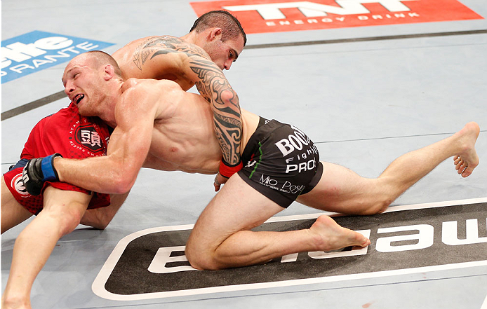 GOIANIA, BRAZIL - NOVEMBER 09: (R-L) Ryan LaFlare attempts to take down Santiago Ponzinibbio in their welterweight bout during the UFC event at Arena Goiania on November 9, 2013 in Goiania, Brazil. (Photo by Josh Hedges/Zuffa LLC/Zuffa LLC via Getty Image