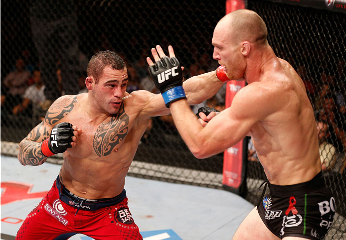 GOIANIA, BRAZIL - NOVEMBER 09: (L-R) Santiago Ponzinibbio punches Ryan LaFlare in their welterweight bout during the UFC event at Arena Goiania on November 9, 2013 in Goiania, Brazil. (Photo by Josh Hedges/Zuffa LLC/Zuffa LLC via Getty Images)
