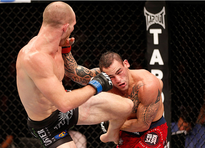 GOIANIA, BRAZIL - NOVEMBER 09: (L-R) Ryan LaFlare knees Santiago Ponzinibbio in their welterweight bout during the UFC event at Arena Goiania on November 9, 2013 in Goiania, Brazil. (Photo by Josh Hedges/Zuffa LLC/Zuffa LLC via Getty Images)