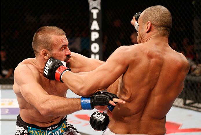 GOIANIA, BRAZIL - NOVEMBER 09: (R-L) Rafael ''Fejao'' Cavalcante punches Igor Pokrajac in their light heavyweight bout during the UFC event at Arena Goiania on November 9, 2013 in Goiania, Brazil. (Photo by Josh Hedges/Zuffa LLC/Zuffa LLC via Getty Images
