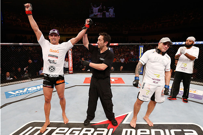 GOIANIA, BRAZIL - NOVEMBER 09: Cezar ''Mutante'' Ferreira (L) reacts after his split decision victory over Daniel Sarafian (R) in their middleweight bout during the UFC event at Arena Goiania on November 9, 2013 in Goiania, Brazil. (Photo by Josh Hedges/Z