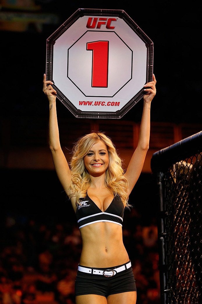 GOIANIA, BRAZIL - NOVEMBER 09: UFC Octagon Girl Jhenny Andrade introduces a round during the UFC event at Arena Goiania on November 9, 2013 in Goiania, Brazil. (Photo by Josh Hedges/Zuffa LLC/Zuffa LLC via Getty Images)