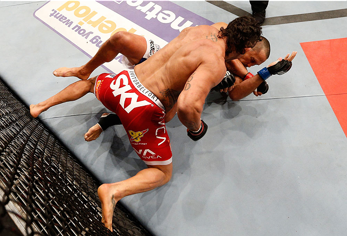 GOIANIA, BRAZIL - NOVEMBER 09: (L-R) Vitor Belfort punches Dan Henderson in their light heavyweight bout during the UFC event at Arena Goiania on November 9, 2013 in Goiania, Brazil. (Photo by Josh Hedges/Zuffa LLC/Zuffa LLC via Getty Images)