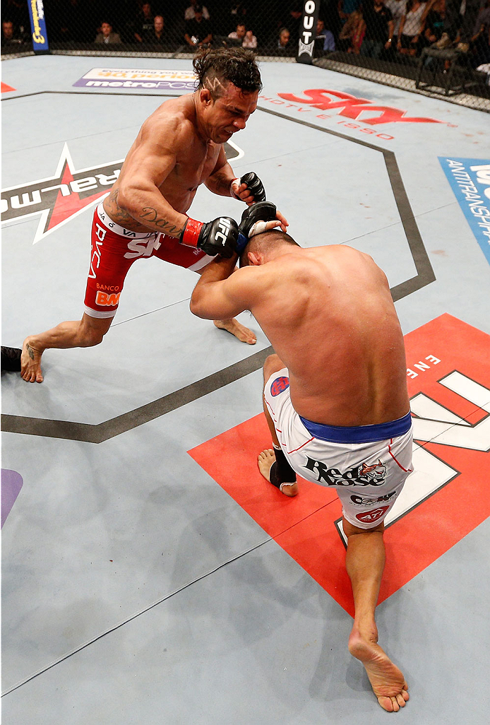 GOIANIA, BRAZIL - NOVEMBER 09: (L-R) Vitor Belfort punches Dan Henderson in their light heavyweight bout during the UFC event at Arena Goiania on November 9, 2013 in Goiania, Brazil. (Photo by Josh Hedges/Zuffa LLC/Zuffa LLC via Getty Images)