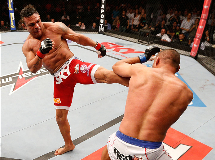 GOIANIA, BRAZIL - NOVEMBER 09: (L-R) Vitor Belfort kicks Dan Henderson in their light heavyweight bout during the UFC event at Arena Goiania on November 9, 2013 in Goiania, Brazil. (Photo by Josh Hedges/Zuffa LLC/Zuffa LLC via Getty Images)