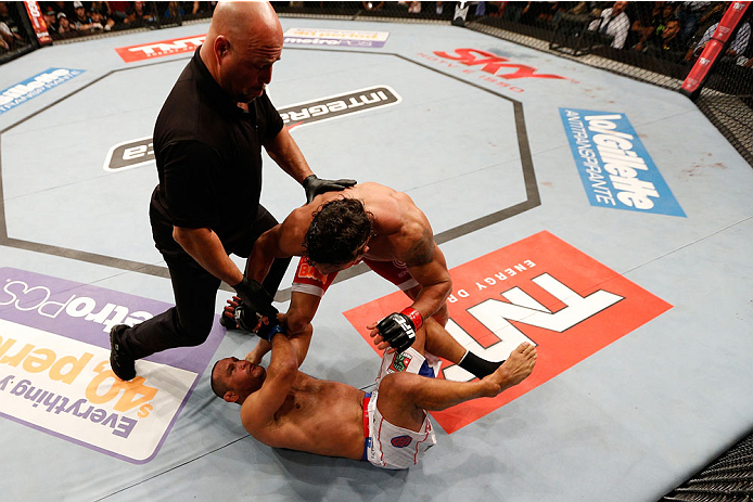 GOIANIA, BRAZIL - NOVEMBER 09: Referee Dan Miragliotta (L) moves in to stop the fight as Vitor Belfort (red shorts) knocks out Dan Henderson in their light heavyweight bout during the UFC event at Arena Goiania on November 9, 2013 in Goiania, Brazil. (Ph