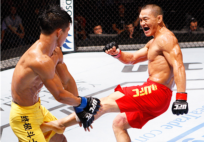 MACAU - AUGUST 23: Ning Guangyou kicks Yang Jianping in their featherweight fight during the UFC Fight Night event at the Venetian Macau on August 23, 2014 in Macau. (Photo by Mitch Viquez/Zuffa LLC/Zuffa LLC via Getty Images)