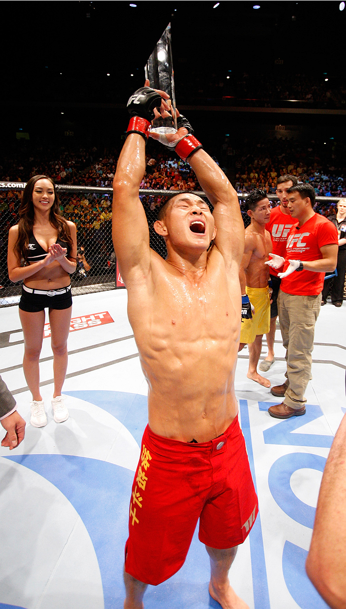 MACAU - AUGUST 23: Ning Guangyou celebrates after defeating Yang Jianping in their featherweight fight during the UFC Fight Night event at the Venetian Macau on August 23, 2014 in Macau. (Photo by Mitch Viquez/Zuffa LLC/Zuffa LLC via Getty Images)