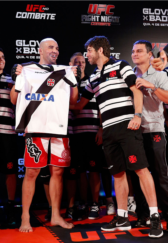 BELO HORIZONTE, BRAZIL - SEPTEMBER 02: (R-L) Juninho of Vasco da Gama presents Glover Teixeira with a jersey after an open training session for media at the Ouro Minas Palace Hotel on September 2, 2013 in Belo Horizonte, Brazil. (Photo by Josh Hedges/Zuf