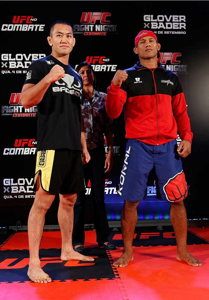 BELO HORIZONTE, BRAZIL - SEPTEMBER 02: (L-R) Opponents Yushin Okami and Ronaldo "Jacare" Souza pose for photos after an open training session for media at the Ouro Minas Palace Hotel on September 2, 2013 in Belo Horizonte, Brazil. (Photo by Josh Hedges/Z