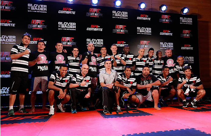 BELO HORIZONTE, BRAZIL - SEPTEMBER 02: Members of the CR Vasco da Gama football club pose for a photo with Glover Teixeira (top row, fifth left) after an open training session for media at the Ouro Minas Palace Hotel on September 2, 2013 in Belo Horizont