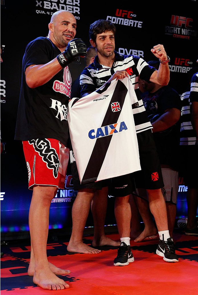 BELO HORIZONTE, BRAZIL - SEPTEMBER 02: (R-L) Juninho of Vasco da Gama presents Glover Teixeira with a jersey after an open training session for media at the Ouro Minas Palace Hotel on September 2, 2013 in Belo Horizonte, Brazil. (Photo by Josh Hedges/Zuf