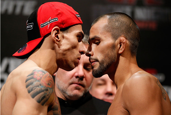 BELO HORIZONTE, BRAZIL - SEPTEMBER 03: (L-R) Opponents Lucas Martins and Junior Hernandez face off during the UFC weigh-in event at Mineirinho Arena on September 3, 2013 in Belo Horizonte, Brazil. (Photo by Josh Hedges/Zuffa LLC/Zuffa LLC via Getty Image