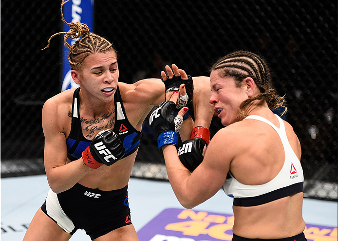 LAS VEGAS, NEVADA - DECEMBER 10: (L) Kailan Curran punches Emily Kagan in their women's strawweight bout during the UFC Fight Night event at The Chelsea at the Cosmopolitan of Las Vegas on December 10, 2015 in Las Vegas, Nevada. (Photo by Jeff Bottari/Z
