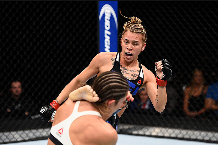 LAS VEGAS, NEVADA - DECEMBER 10: (R) Kailan Curran kicks Emily Kagan in their women's strawweight bout during the UFC Fight Night event at The Chelsea at the Cosmopolitan of Las Vegas on December 10, 2015 in Las Vegas, Nevada. (Photo by Jeff Bottari/Zuf