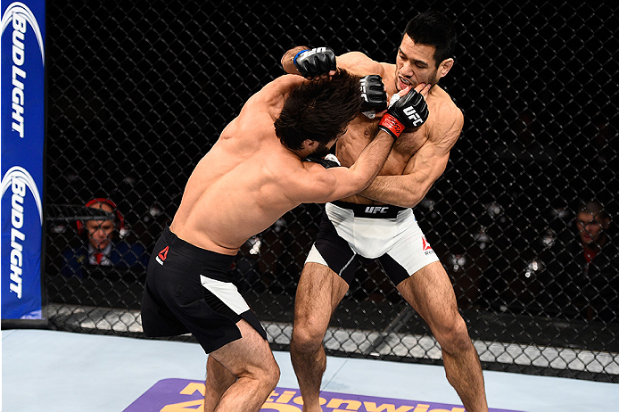 LAS VEGAS, NEVADA - DECEMBER 10: (L) Zubaira Tukhugov and Phillipe Nover exchange punches in their featherweight bout during the UFC Fight Night event at The Chelsea at the Cosmopolitan of Las Vegas on December 10, 2015 in Las Vegas, Nevada. (Photo by J