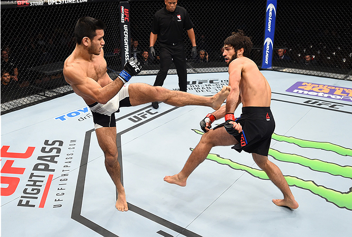 LAS VEGAS, NEVADA - DECEMBER 10: (L) Phillipe Nover kicks Zubaira Tukhugov in their featherweight bout during the UFC Fight Night event at The Chelsea at the Cosmopolitan of Las Vegas on December 10, 2015 in Las Vegas, Nevada. (Photo by Jeff Bottari/Zuf
