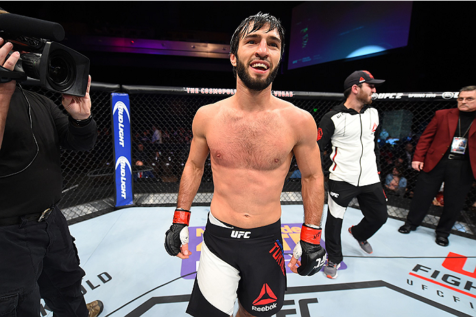 LAS VEGAS, NEVADA - DECEMBER 10: (L) Zubaira Tukhugov celebrates his win over Phillipe Nover in their featherweight bout during the UFC Fight Night event at The Chelsea at the Cosmopolitan of Las Vegas on December 10, 2015 in Las Vegas, Nevada. (Photo b