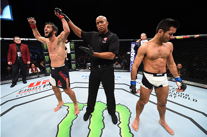 LAS VEGAS, NEVADA - DECEMBER 10: (L) Zubaira Tukhugov celebrates his win over Phillipe Nover in their featherweight bout during the UFC Fight Night event at The Chelsea at the Cosmopolitan of Las Vegas on December 10, 2015 in Las Vegas, Nevada. (Photo b
