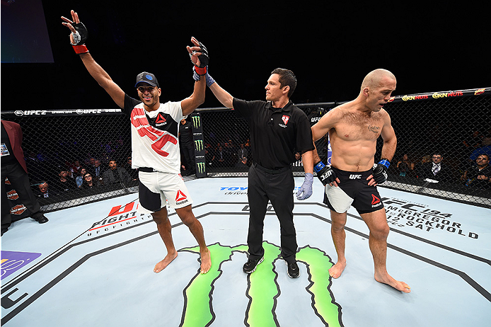 LAS VEGAS, NEVADA - DECEMBER 10: (L) Danny Roberts celebrates his win over Nathan Coy in their welterweight bout during the UFC Fight Night event at The Chelsea at the Cosmopolitan of Las Vegas on December 10, 2015 in Las Vegas, Nevada. (Photo by Jeff B