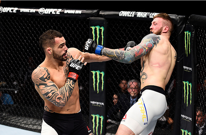 LAS VEGAS, NEVADA - DECEMBER 10: (L) Santiago Ponzinibbio exchanges punches with Andreas Stahl in their welterweight bout during the UFC Fight Night event at The Chelsea at the Cosmopolitan of Las Vegas on December 10, 2015 in Las Vegas, Nevada. (Photo