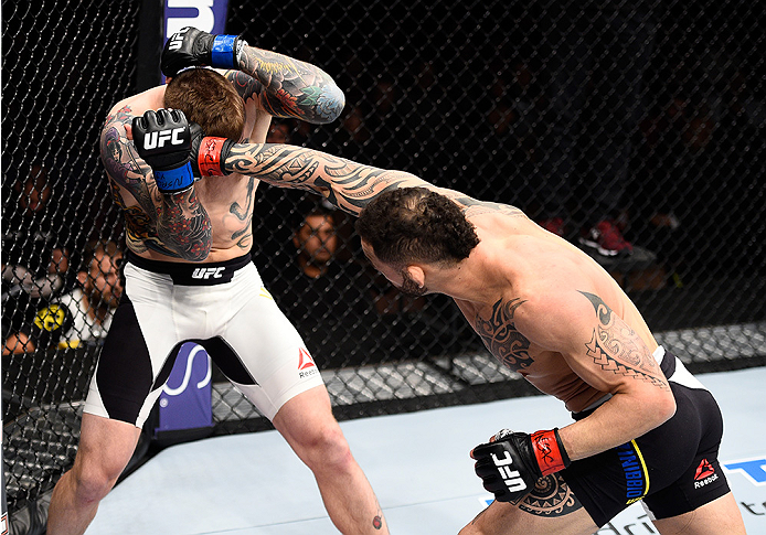 LAS VEGAS, NEVADA - DECEMBER 10: (R) Santiago Ponzinibbio punches Andreas Stahl in their welterweight bout during the UFC Fight Night event at The Chelsea at the Cosmopolitan of Las Vegas on December 10, 2015 in Las Vegas, Nevada. (Photo by Jeff Bottari